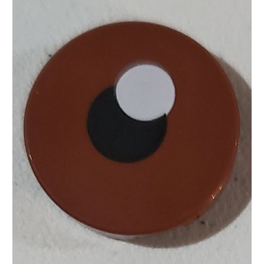 reddish brown tile round 2 x 2 with bottom stud holder with black pupil and white glint pattern