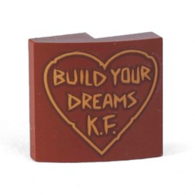 reddish brown slope curved 2 x 2 x 2 3 with build your dreams k.f in outlined heart pattern