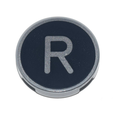 light bluish gray tile round 2 x 2 with bottom stud holder with silver capital letter r on black background pattern