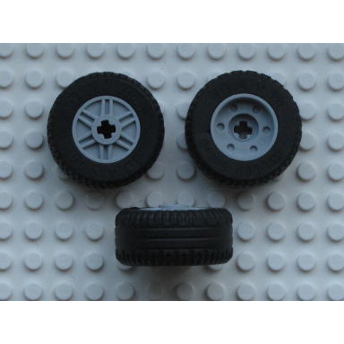light bluish gray wheel 18mm d x 14mm with axle hole fake bolts and shallow spokes with black tire 30.4 x 14 solid 55982 58090
