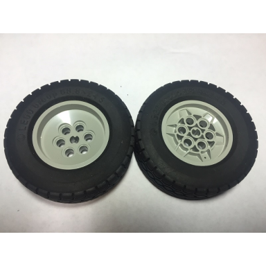 light gray wheel 68.8 x 24 model team type 2 notches around wheel ring with black tire 68.8 x 24 32004b 32003