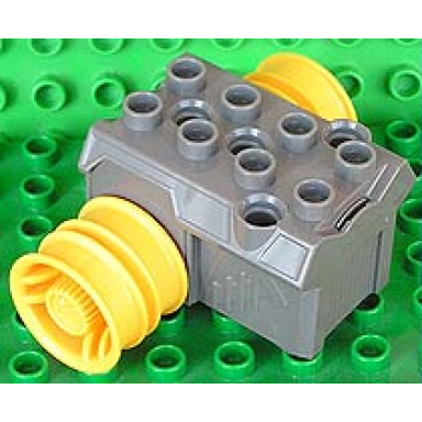 dark gray duplo toolo pullback motor 3 x 4 with yellow wheels