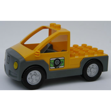 bright light orange duplo truck pickup flatbed with dark bluish gray base with tire and tools pattern