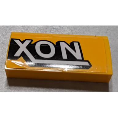 bright light orange slope curved 2 x 4 x 2 3 with bottom tubes with black and white xon pattern side b sticker - set 76067
